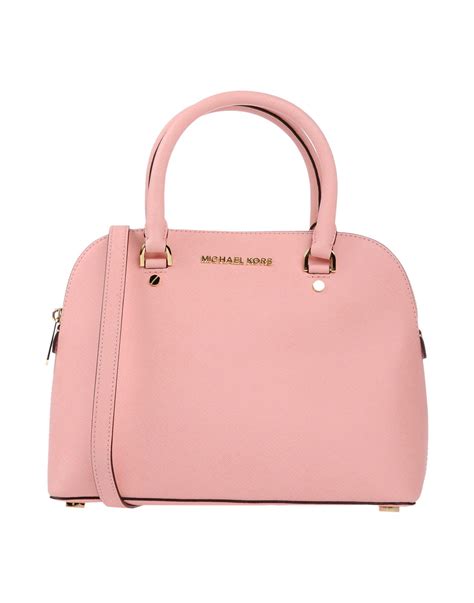 michael kors purse pink and white|More.